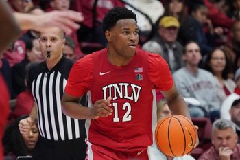 Dec 7, 2025; Stanford, California, USA;  UNLV Runnin' Rebels guard Issac Williamson (12) dribbles upcourt against the Stanford Cardinal in the second half at Maples Pavilion. Mandatory Credit: David Gonzales-Imagn Images