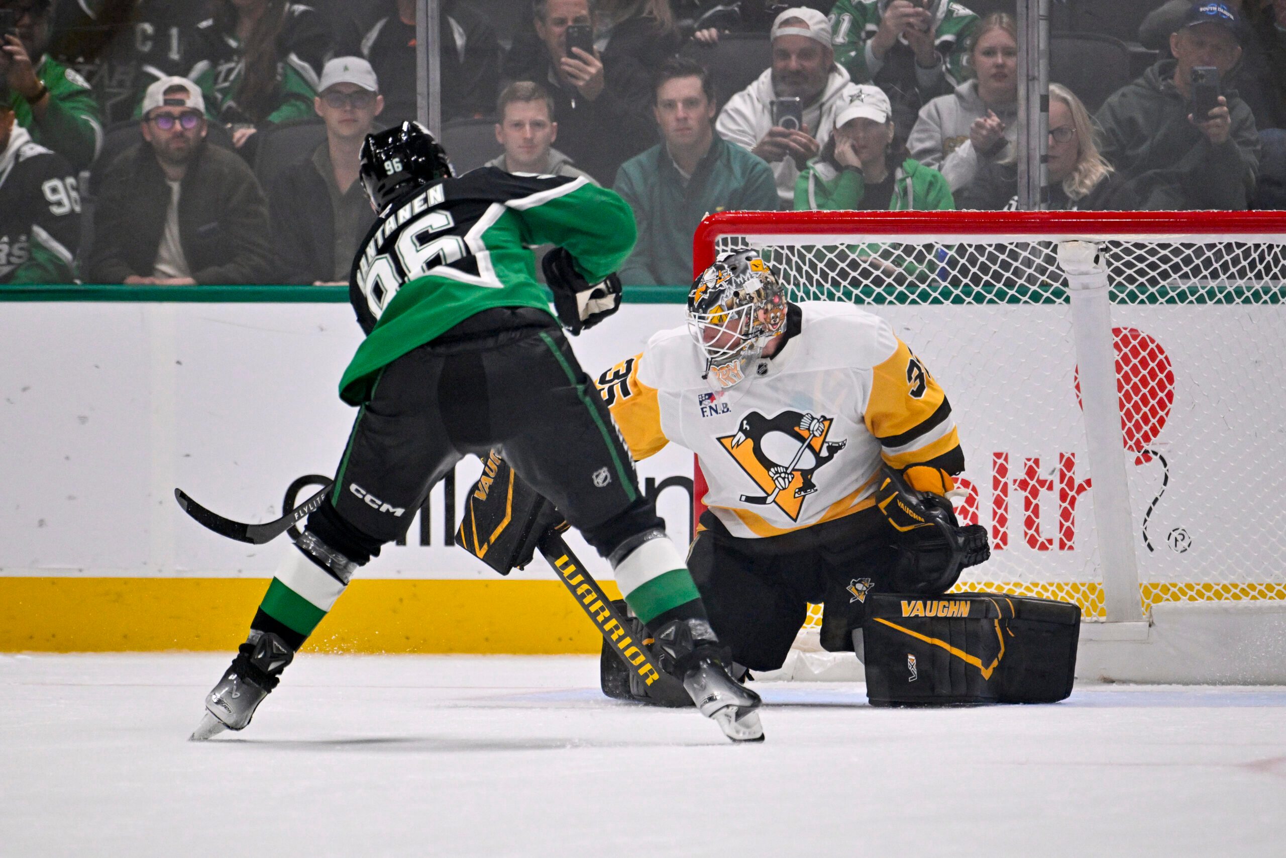 Dec 7, 2025; Dallas, Texas, USA; Dallas Stars right wing Mikko Rantanen (96) scores the game winning goal against Pittsburgh Penguins goaltender Tristan Jarry (35) during the overtime shootout period at American Airlines Center. Mandatory Credit: Jerome Miron-Imagn Images