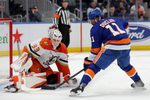 Dec 11, 2025; Elmont, New York, USA; Anaheim Ducks goaltender Ville Husso (33) makes a save against New York Islanders left wing Anthony Duclair (11) during the second period at UBS Arena. Mandatory Credit: Brad Penner-Imagn Images