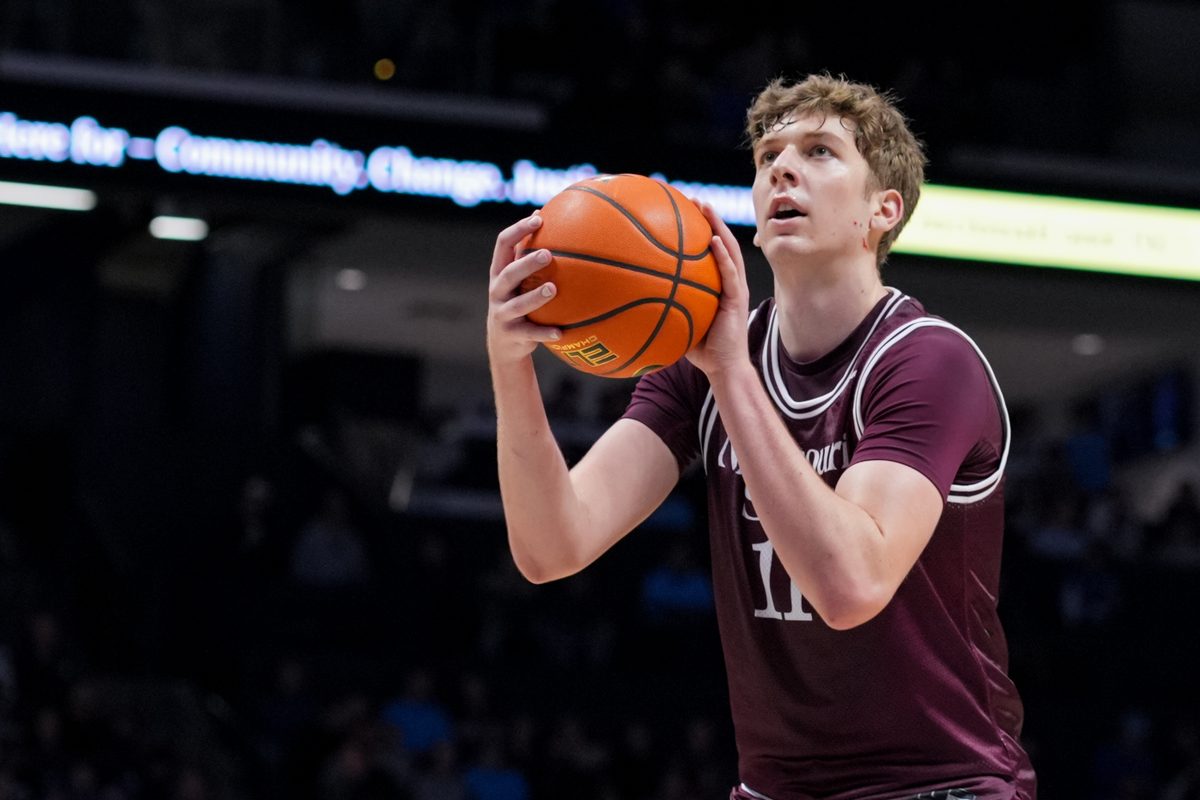 Dec 12, 2025; Cincinnati, Ohio, USA; Missouri State Bears forward Keith Palek III (11) attempts a free throw against the Xavier Musketeers in the second half at the Cintas Center. Mandatory Credit: Aaron Doster-Imagn Images
