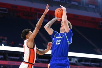 Dec 17, 2025; Syracuse, New York, USA; Mercyhurst Lakers guard Kaden Fuhrmann (15) shoots against Syracuse Orange guard Kiyan Anthony (7) during the first half at the JMA Wireless Dome. Mandatory Credit: Rich Barnes-Imagn Images
