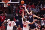 Dec 20, 2025; Piscataway, New Jersey, USA; Penn Quakers guard Michael Zanoni (7) scores a basket against Rutgers Scarlet Knights guard Harun Zrno (13) during the second half at Jersey Mike's Arena. Mandatory Credit: Vincent Carchietta-Imagn Images