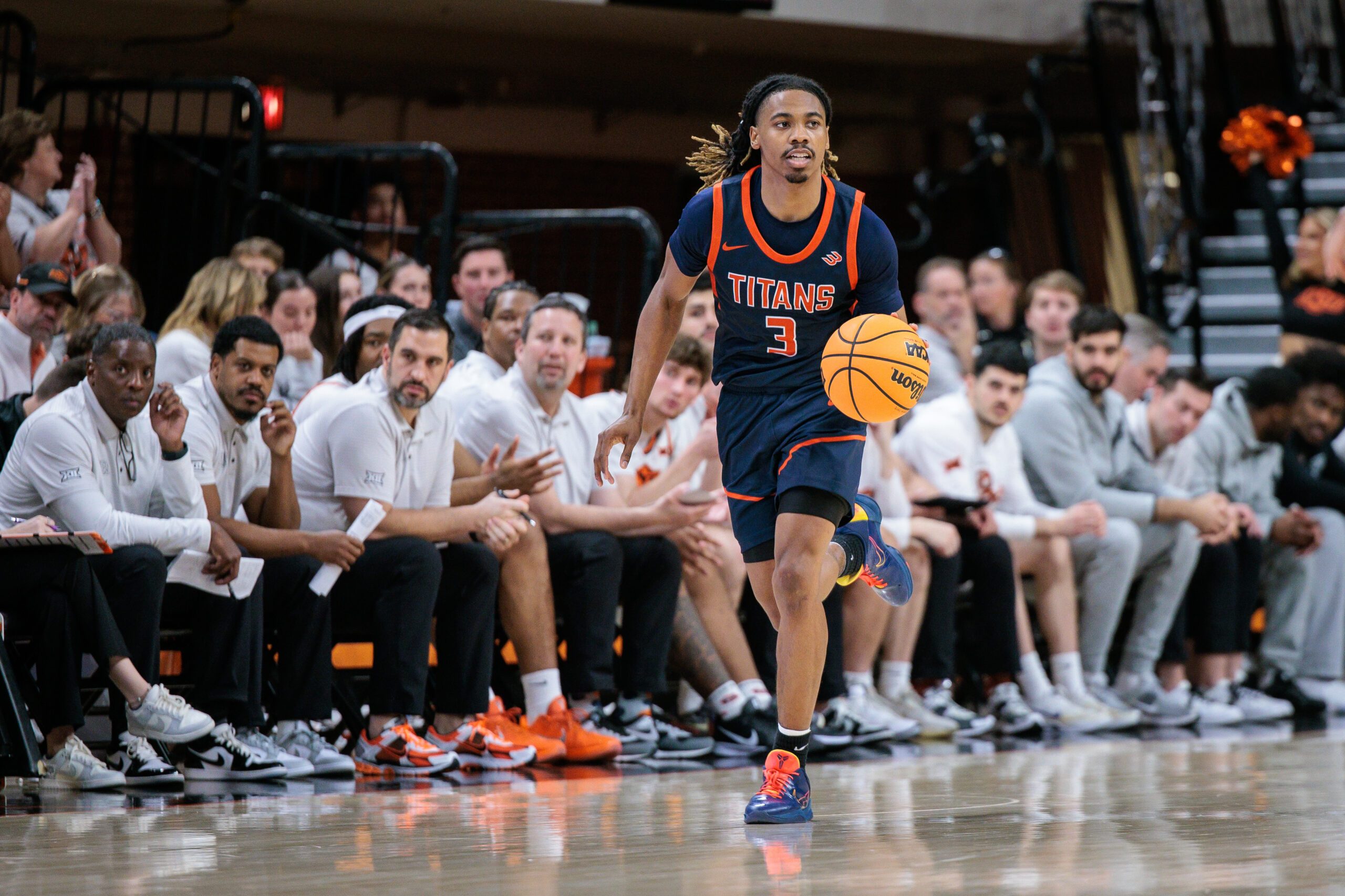 Dec 21, 2025; Stillwater, Oklahoma, USA; Cal State Fullerton Titans guard Joshua Ward (3) brings the ball up court during the second half against the Oklahoma State Cowboys at Gallagher-Iba Arena. Mandatory Credit: William Purnell-Imagn Images