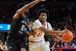 Iowa State Cyclones guard Dominick Nelson (11) drives with the ball around Long Beach State guard Cole Farrell (10) during the second half in the NCAA men’s basketball on Dec. 21, 2025, at Hilton Coliseum in Ames, Iowa.