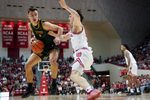 Dec 22, 2025; Bloomington, Indiana, USA; Siena Saints guard Gavin Doty (4) goes to the basket against Indiana Hoosiers guard Conor Enright (5) during the second half at Simon Skjodt Assembly Hall. Mandatory Credit: Robert Goddin-Imagn Images