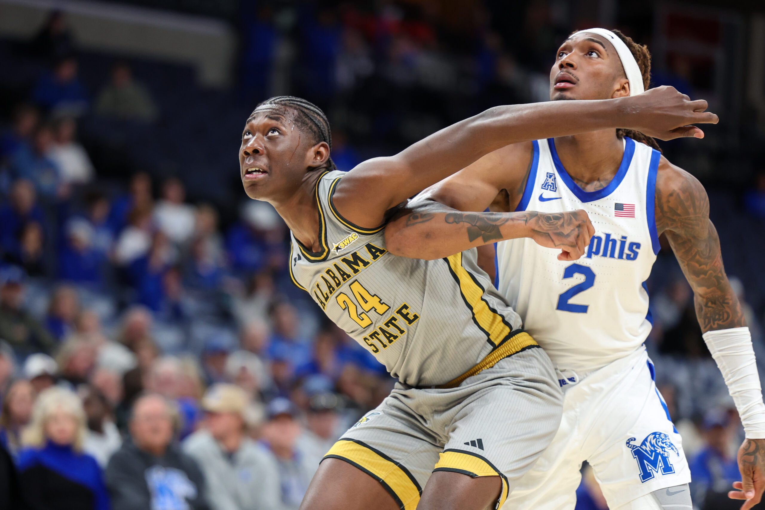 Dec 22, 2025; Memphis, Tennessee, USA; Alabama State Hornets forward Jerquarius Stanback (24) get position against Memphis Tigers guard Zach Davis (2) during the second half at FedExForum. Mandatory Credit: Wesley Hale-Imagn Images