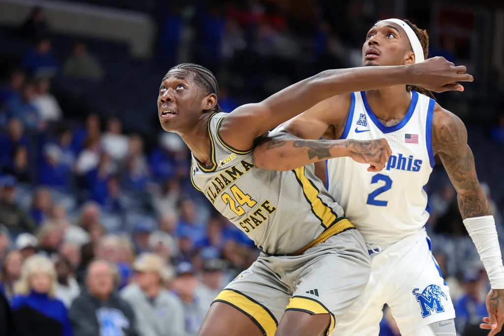 Dec 22, 2025; Memphis, Tennessee, USA; Alabama State Hornets forward Jerquarius Stanback (24) get position against Memphis Tigers guard Zach Davis (2) during the second half at FedExForum. Mandatory Credit: Wesley Hale-Imagn Images