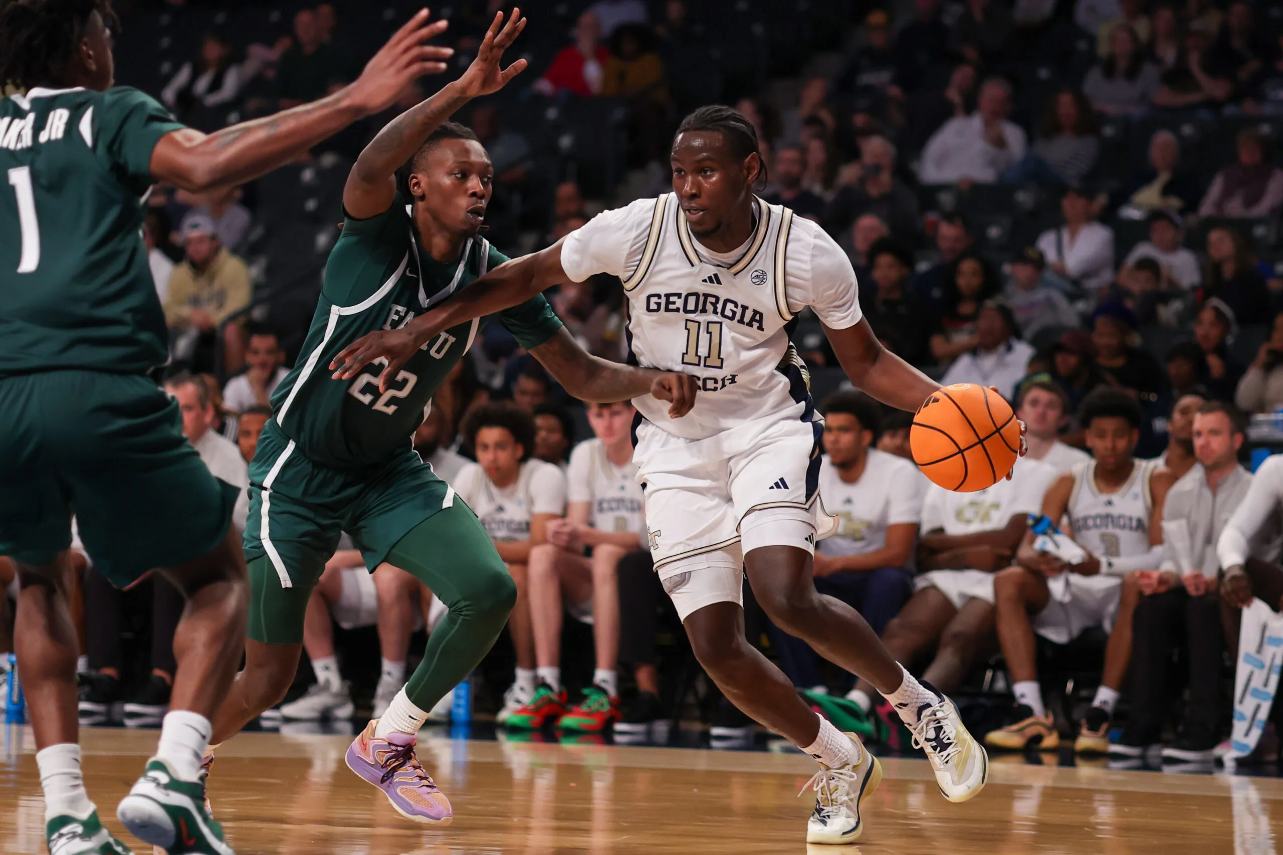 Dec 28, 2025; Atlanta, Georgia, USA; Georgia Tech Yellow Jackets forward Baye Ndongo (11) drives on Florida A&M Rattlers forward Tyler Shirley (22) in the second half at McCamish Pavilion. Mandatory Credit: Brett Davis-Imagn Images