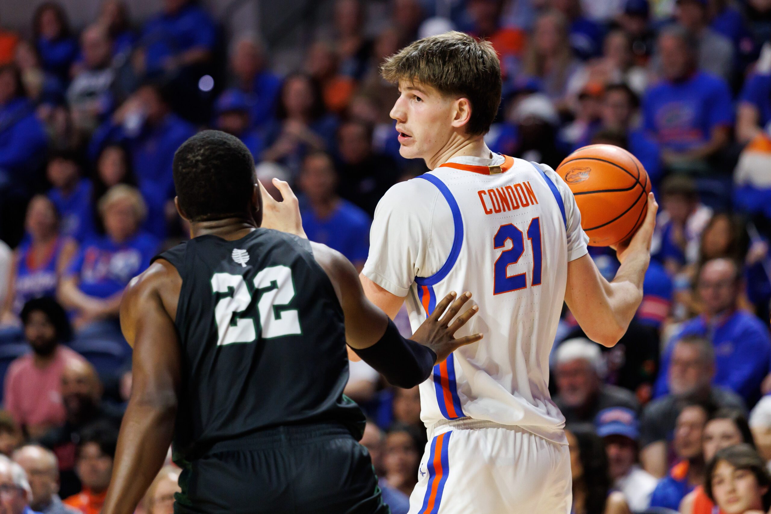 Dec 29, 2025; Gainesville, Florida, USA; Florida Gators forward Alex Condon (21) posts up against Dartmouth Big Green forward Jayden Williams (22) during the second half at Exactech Arena at the Stephen C. O'Connell Center. Mandatory Credit: Matt Pendleton-Imagn Images