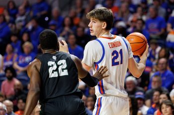 Dec 29, 2025; Gainesville, Florida, USA; Florida Gators forward Alex Condon (21) posts up against Dartmouth Big Green forward Jayden Williams (22) during the second half at Exactech Arena at the Stephen C. O'Connell Center. Mandatory Credit: Matt Pendleton-Imagn Images
