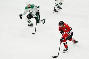 Jan 1, 2026; Chicago, Illinois, USA; Dallas Stars defenseman Nils Lundkvist (5) defends Chicago Blackhawks right wing Ilya Mikheyev (95) during the third period at United Center. Mandatory Credit: David Banks-Imagn Images