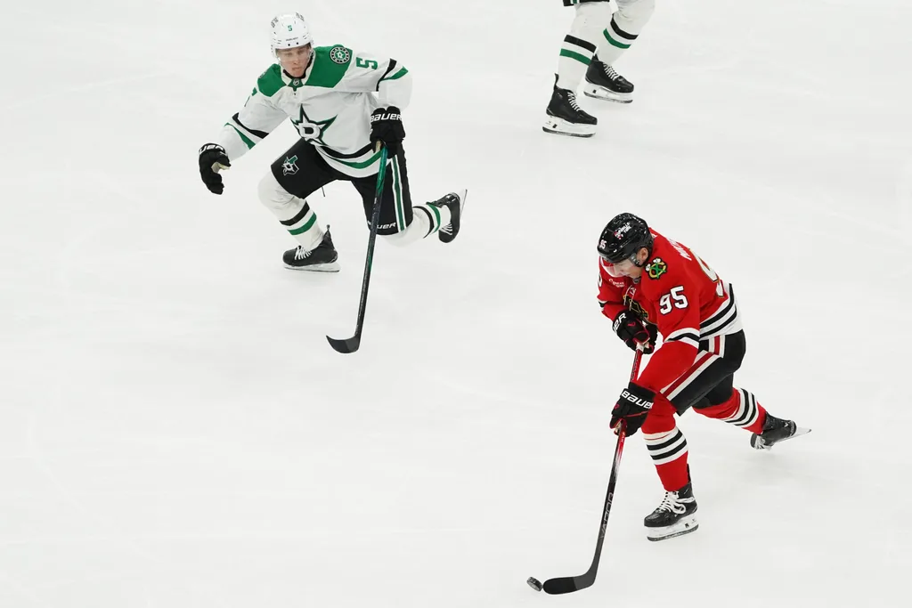 Jan 1, 2026; Chicago, Illinois, USA; Dallas Stars defenseman Nils Lundkvist (5) defends Chicago Blackhawks right wing Ilya Mikheyev (95) during the third period at United Center. Mandatory Credit: David Banks-Imagn Images
