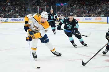 Jan 1, 2026; Seattle, Washington, USA; Nashville Predators center Fedor Svechkov (40) plays the puck during the third period against the Seattle Kraken at Climate Pledge Arena. Mandatory Credit: Steven Bisig-Imagn Images
