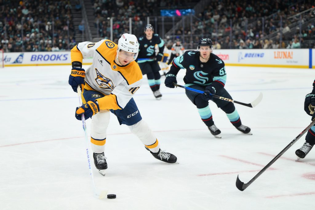 Jan 1, 2026; Seattle, Washington, USA; Nashville Predators center Fedor Svechkov (40) plays the puck during the third period against the Seattle Kraken at Climate Pledge Arena. Mandatory Credit: Steven Bisig-Imagn Images