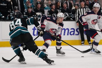 Jan 6, 2026; San Jose, California, USA;  Columbus Blue Jackets defenseman Denton Mateychuk (5) looks to pass against San Jose Sharks left wing Pavol Regenda (84) in the third period at SAP Center at San Jose. Mandatory Credit: David Gonzales-Imagn Images