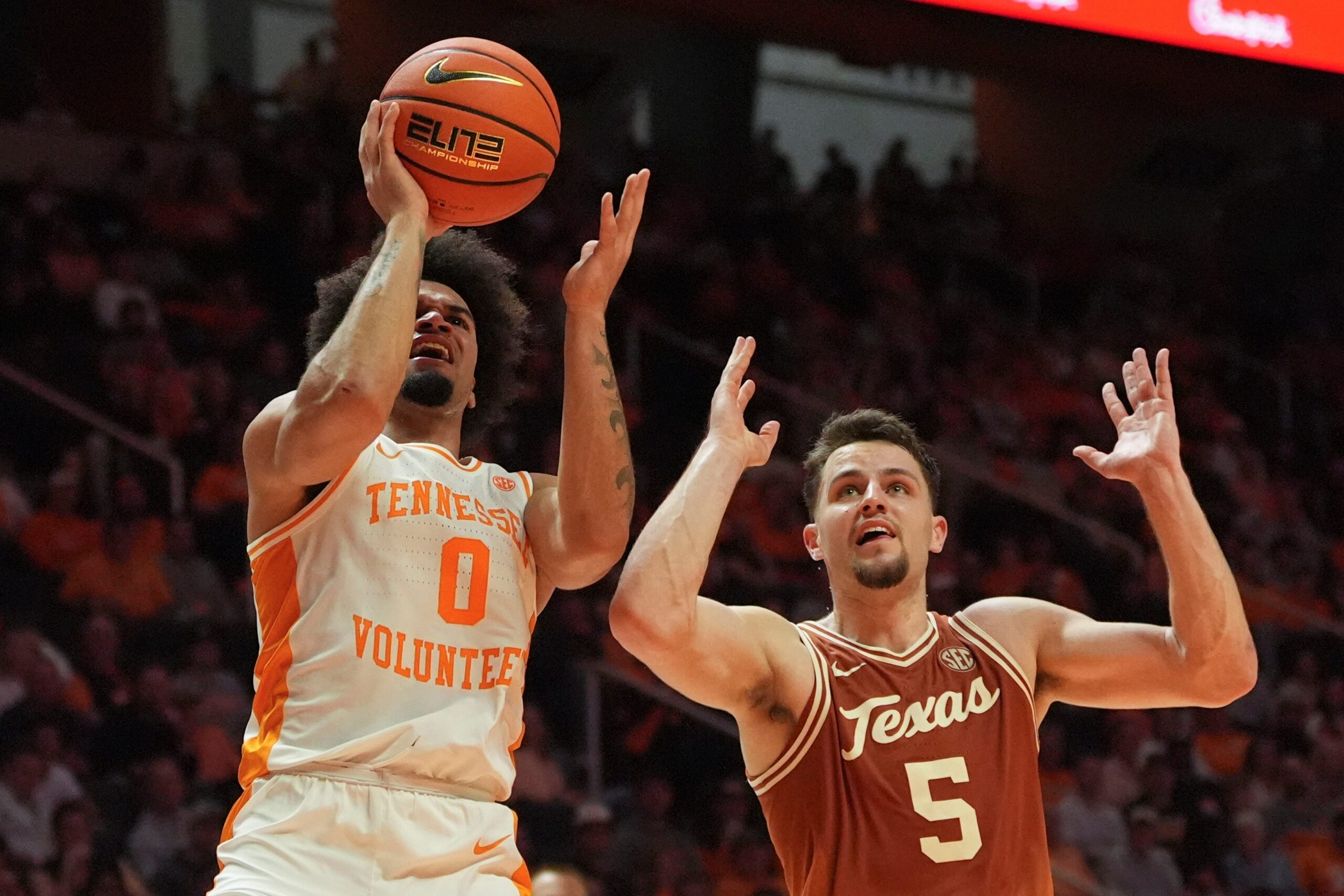 Tennessee guard Ja’Kobi Gillespie (0) tries to get the shot off while guarded by Texas forward Camden Heide (5) in an NCAA college basketball game on January 6, 2026, in Knoxville, Tenn.