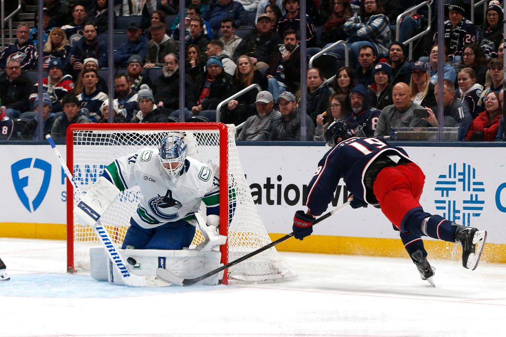 Jan 15, 2026; Columbus, Ohio, USA; Vancouver Canucks goalie Kevin Lankinen (32) makes a save on the shot attempt of Columbus Blue Jackets center Adam Fantilli (19) during the third period at Nationwide Arena. Mandatory Credit: Russell LaBounty-Imagn Images