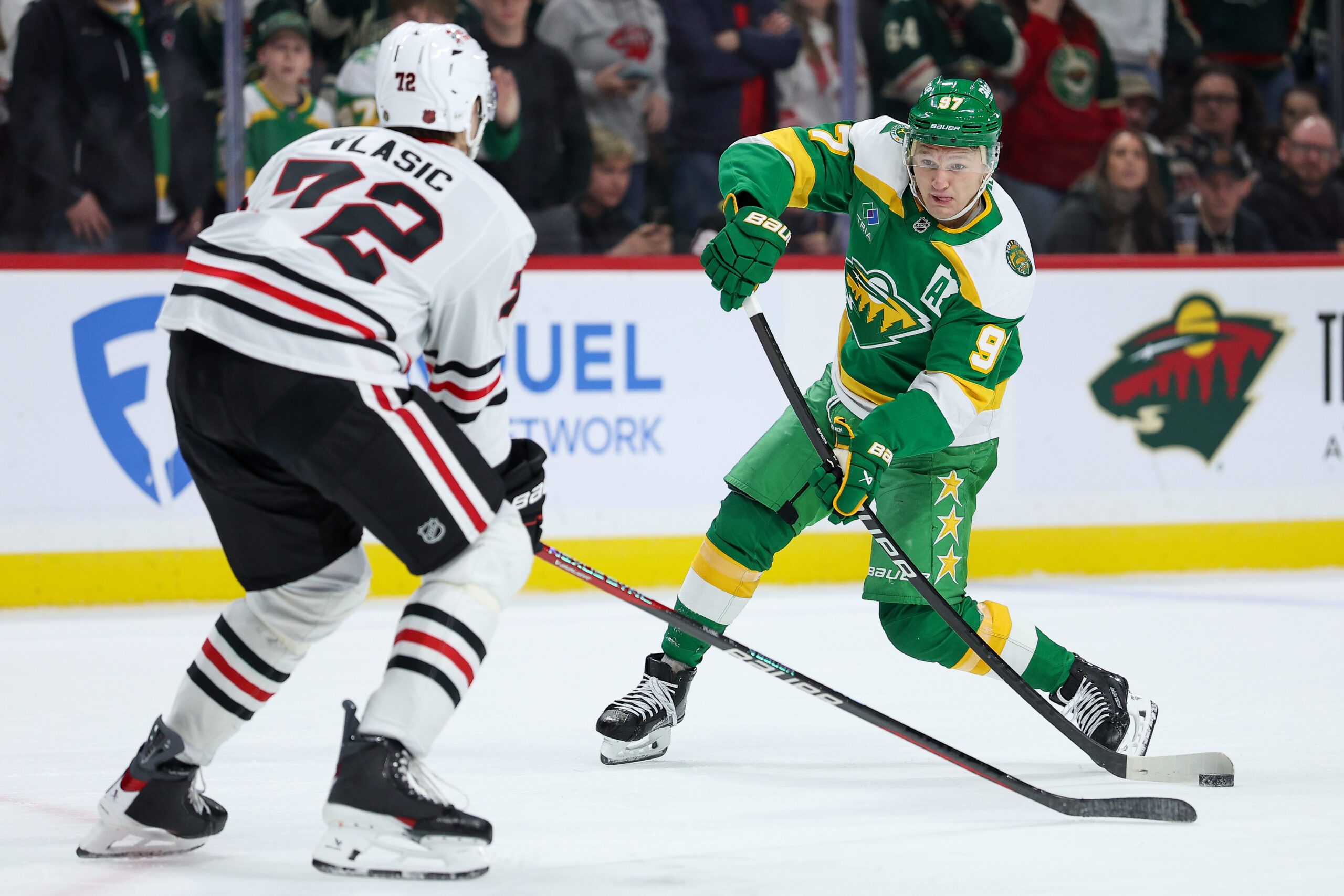 Jan 27, 2026; Saint Paul, Minnesota, USA; Minnesota Wild left wing Kirill Kaprizov (97) shoots the puck as Chicago Blackhawks defenseman Alex Vlasic (72) defends during overtime at Grand Casino Arena. Mandatory Credit: Matt Krohn-Imagn Images