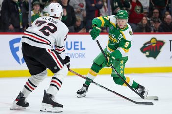 Jan 27, 2026; Saint Paul, Minnesota, USA; Minnesota Wild left wing Kirill Kaprizov (97) shoots the puck as Chicago Blackhawks defenseman Alex Vlasic (72) defends during overtime at Grand Casino Arena. Mandatory Credit: Matt Krohn-Imagn Images