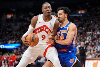 Jan 28, 2026; Toronto, Ontario, CAN; Toronto Raptors forward RJ Barrett (9) and New York Knicks guard Landry Shamet (44) battle for position during the second half at Scotiabank Arena. Mandatory Credit: John E. Sokolowski-Imagn Images