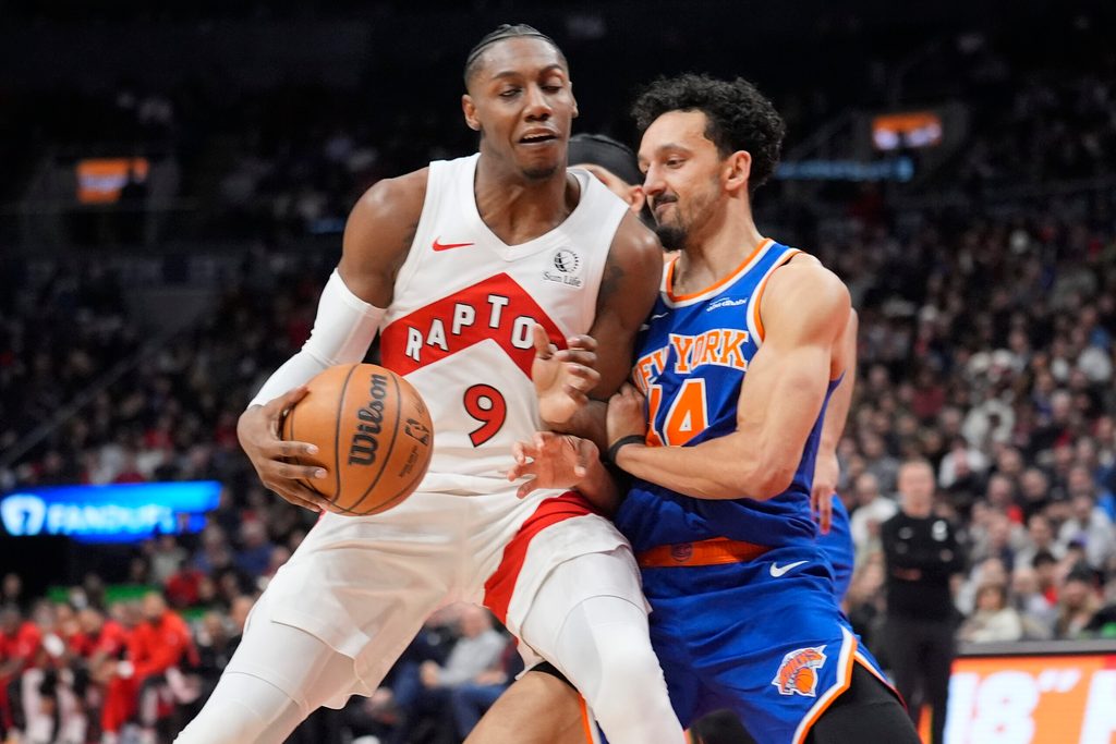 Jan 28, 2026; Toronto, Ontario, CAN; Toronto Raptors forward RJ Barrett (9) and New York Knicks guard Landry Shamet (44) battle for position during the second half at Scotiabank Arena. Mandatory Credit: John E. Sokolowski-Imagn Images