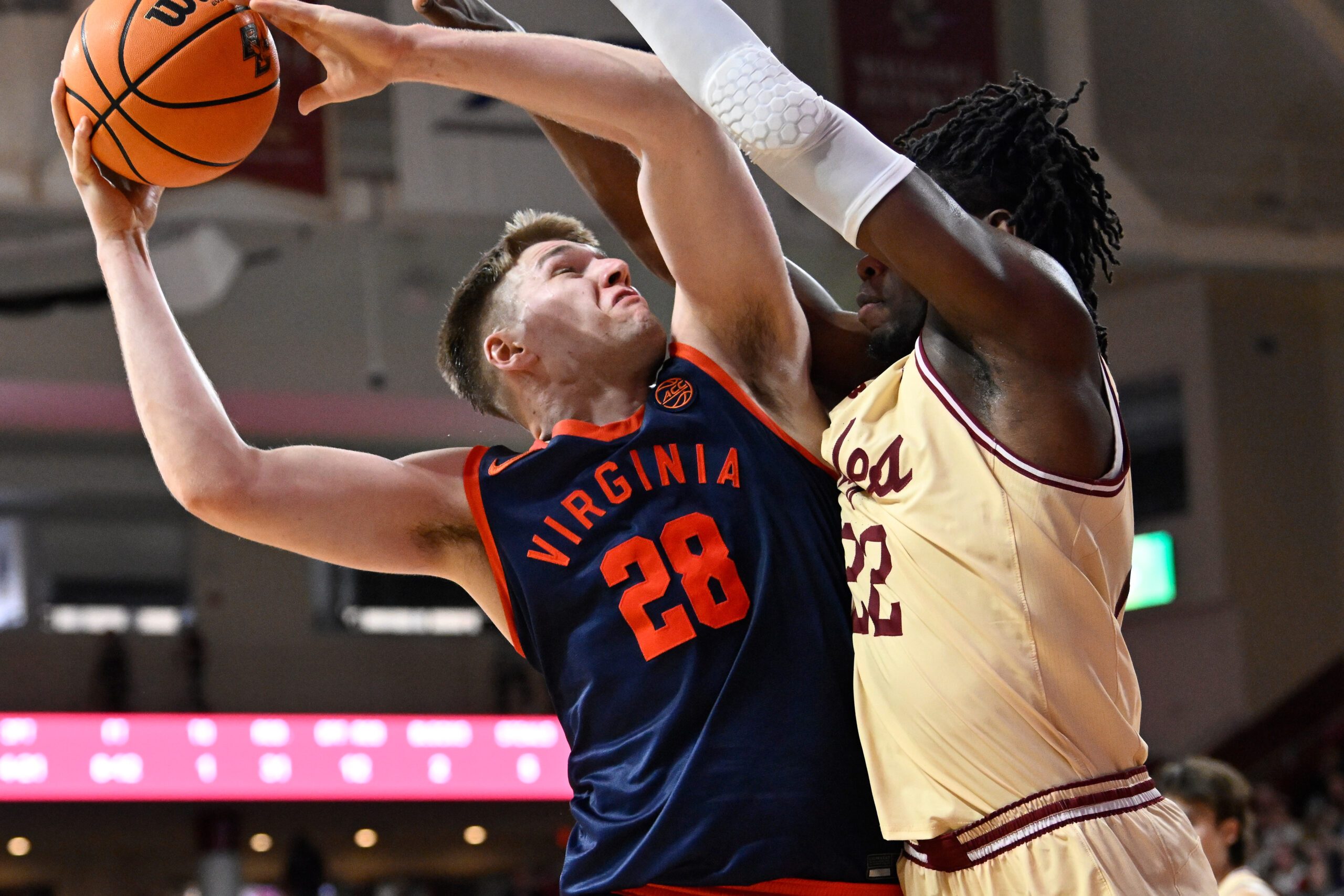 Jan 31, 2026; Chestnut Hill, Massachusetts, USA; Virginia Cavaliers forward Thijs de Ridder (28) shoots a lay up against Boston College Eagles forward Jayden Hastings (22) during the second half at Conte Forum. Mandatory Credit: Eric Canha-Imagn Images