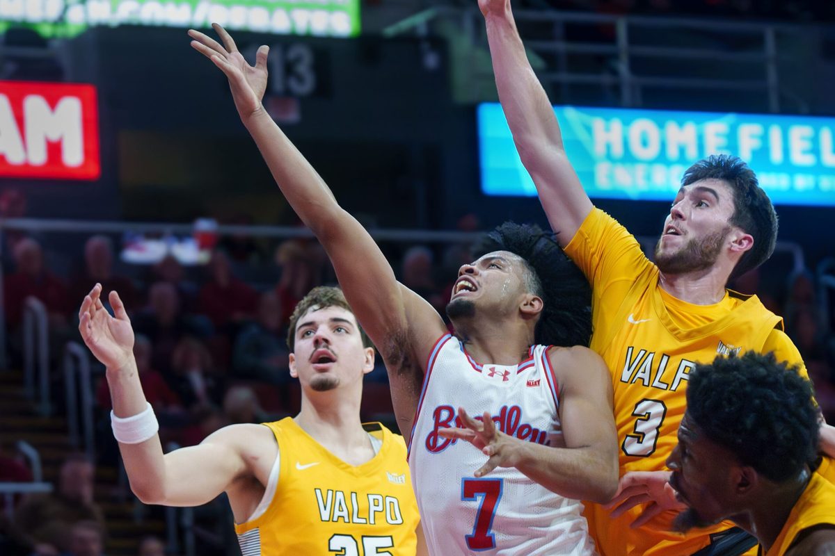 Bradley’s Montana Wheeler (7) gets between Valparaiso’s Brody Whitaker (3) and Tucker Tornatta in the first half of their college basketball game Tuesday, Feb. 3, 2026 at the Peoria Civic Center. The Braves defeated the Beacons 72-65.