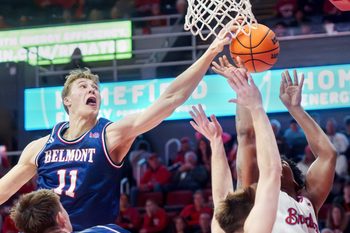 Belmont's Drew Scharnowski (11) blocks a shot by Bradley's Jaquan Johnson in the second half of their college basketball game Monday, Feb. 9, 2026 at Carver Arena in Peoria. Johnson was fouled before the block. The Braves defeated the Bruins 95-84.