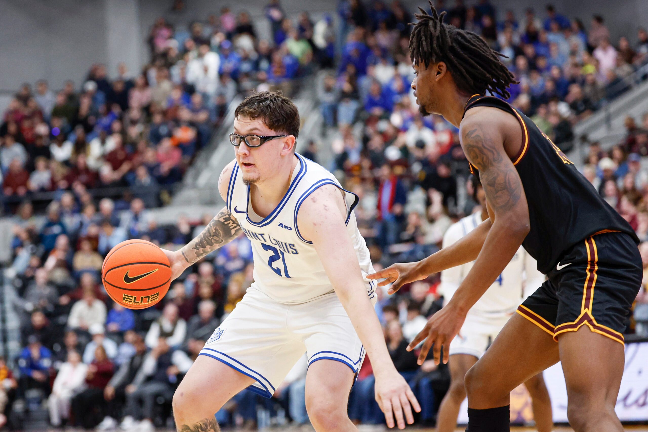 Feb 13, 2026; Chicago, Illinois, USA; Saint Louis Billikens center Robbie Avila (21) controls the ball against the Loyola Chicago Ramblers during the second half at Joseph J. Gentile Arena. Mandatory Credit: Kamil Krzaczynski-Imagn Images