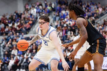 Feb 13, 2026; Chicago, Illinois, USA; Saint Louis Billikens center Robbie Avila (21) controls the ball against the Loyola Chicago Ramblers during the second half at Joseph J. Gentile Arena. Mandatory Credit: Kamil Krzaczynski-Imagn Images