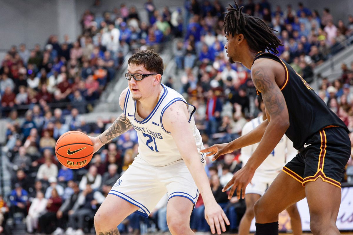 Feb 13, 2026; Chicago, Illinois, USA; Saint Louis Billikens center Robbie Avila (21) controls the ball against the Loyola Chicago Ramblers during the second half at Joseph J. Gentile Arena. Mandatory Credit: Kamil Krzaczynski-Imagn Images