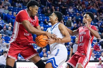 Delaware’s Justyn Fernandez moves between Western Kentucky’s Blaise Keita (left) and Terrion Murdix in the first half of Western Kentucky’s 88-87 overtime win at the Bob Carpenter Center, Feb. 18, 2026.