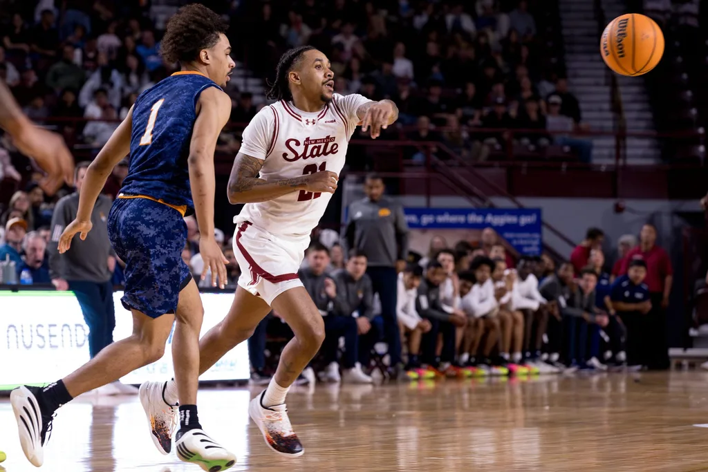 NMSU’s Jemel Jones (21) makes a pass during a game against UTEP at the Pan American Center in Las Cruces, New Mexico, on Saturday, Feb. 21, 2026.