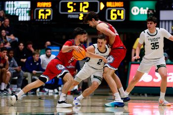 Feb 24, 2026; Fort Collins, Colorado, USA; Fresno State Bulldogs guard Bastien Rieber (21) controls the ball as center Wilson Jacques (16) screens against Colorado State Rams guard Brandon Rechsteiner (2) as forward Kyle Jorgensen (35) defends in the second half at Moby Arena. Mandatory Credit: Isaiah J. Downing-Imagn Images