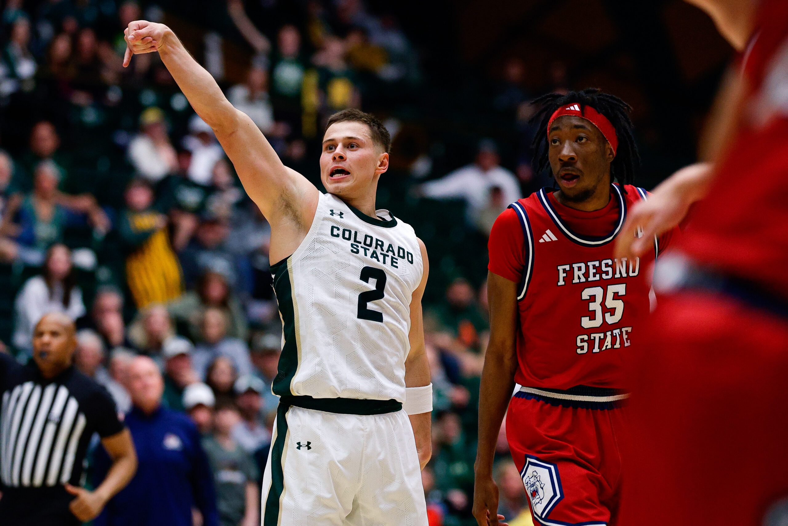 Feb 24, 2026; Fort Collins, Colorado, USA; Colorado State Rams guard Brandon Rechsteiner (2) watches his shot with Fresno State Bulldogs forward Deshawn Gory (35) in the second half at Moby Arena. Mandatory Credit: Isaiah J. Downing-Imagn Images