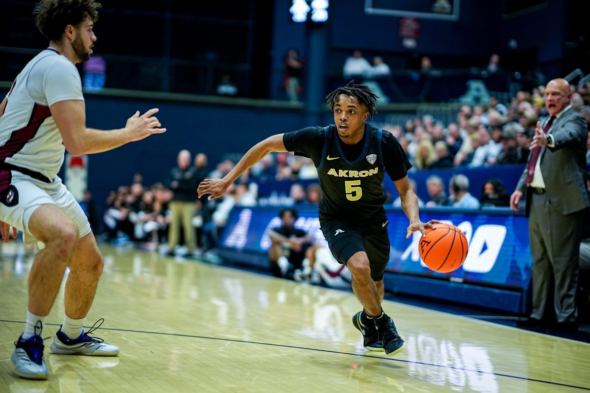 Akron Zips’ Tavari Johnson (5) dribbles in a home game against UMass, Feb. 13, 2026.