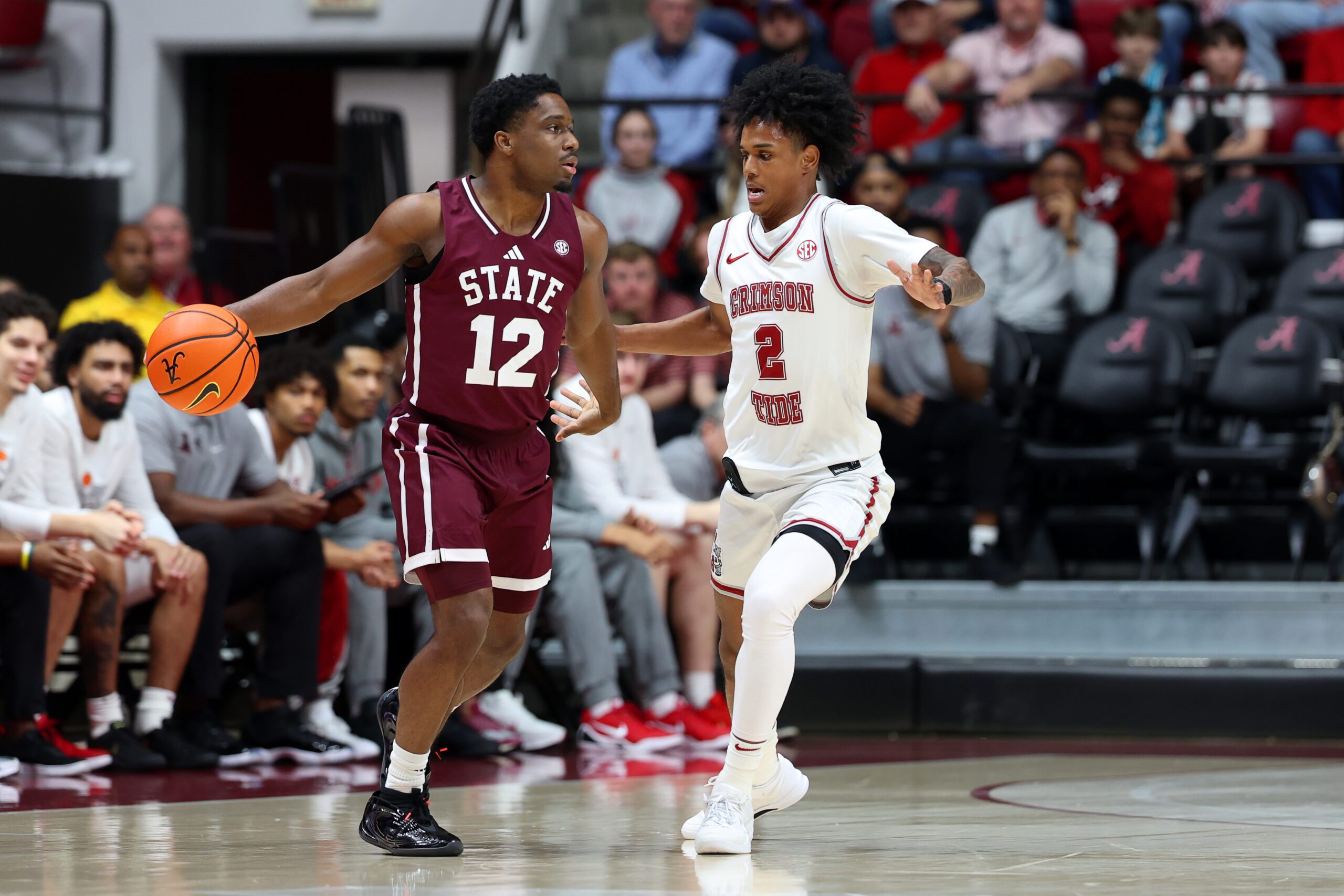 Feb 25, 2026; Tuscaloosa, Alabama, USA; Alabama Crimson Tide guard Aden Holloway (2) guards Mississippi State Bulldogs guard Josh Hubbard (12) during the first half at Coleman Coliseum. Mandatory Credit: David Leong-Imagn Images