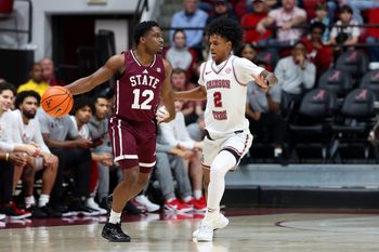 Feb 25, 2026; Tuscaloosa, Alabama, USA; Alabama Crimson Tide guard Aden Holloway (2) guards Mississippi State Bulldogs guard Josh Hubbard (12) during the first half at Coleman Coliseum. Mandatory Credit: David Leong-Imagn Images