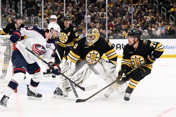 Feb 26, 2026; Boston, Massachusetts, USA; Columbus Blue Jackets center Adam Fantilli (19) shoots the puck over the head of Boston Bruins goaltender Michael DiPietro (80) during the second period at TD Garden. Mandatory Credit: Eric Canha-Imagn Images