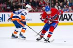Feb 26, 2026; Montreal, Quebec, CAN; New York Islanders defenseman Matthew Schaefer (48) defends the puck against Montreal Canadiens right wing Cole Caufield (13) during overtime at Bell Centre. Mandatory Credit: David Kirouac-Imagn Images