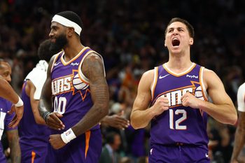 Feb 26, 2026; Phoenix, Arizona, USA; Phoenix Suns forward Royce O'Neale (00) celebrates with guard Collin Gillespie (12) against the Los Angeles Lakers in the second half at Mortgage Matchup Center. Mandatory Credit: Mark J. Rebilas-Imagn Images