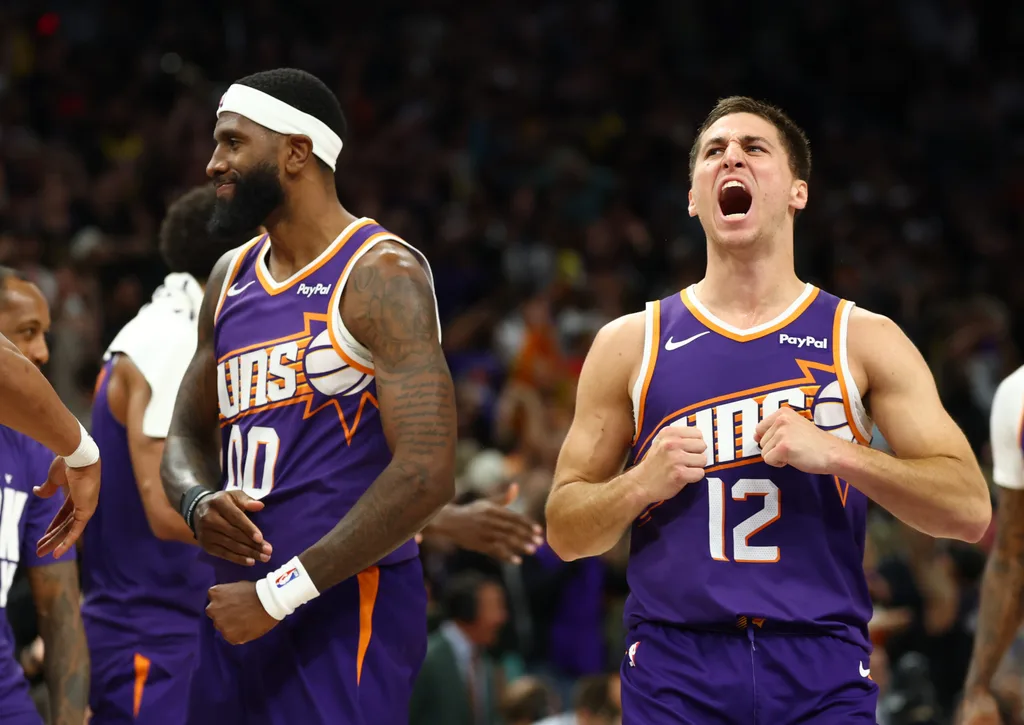 Feb 26, 2026; Phoenix, Arizona, USA; Phoenix Suns forward Royce O'Neale (00) celebrates with guard Collin Gillespie (12) against the Los Angeles Lakers in the second half at Mortgage Matchup Center. Mandatory Credit: Mark J. Rebilas-Imagn Images