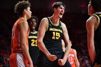 Feb 27, 2026; Champaign, Illinois, USA;  Michigan Wolverines center Aday Mara (15) reacts after scoring  during the second half against the Illinois Fighting Illini at State Farm Center. Mandatory Credit: Ron Johnson-Imagn Images