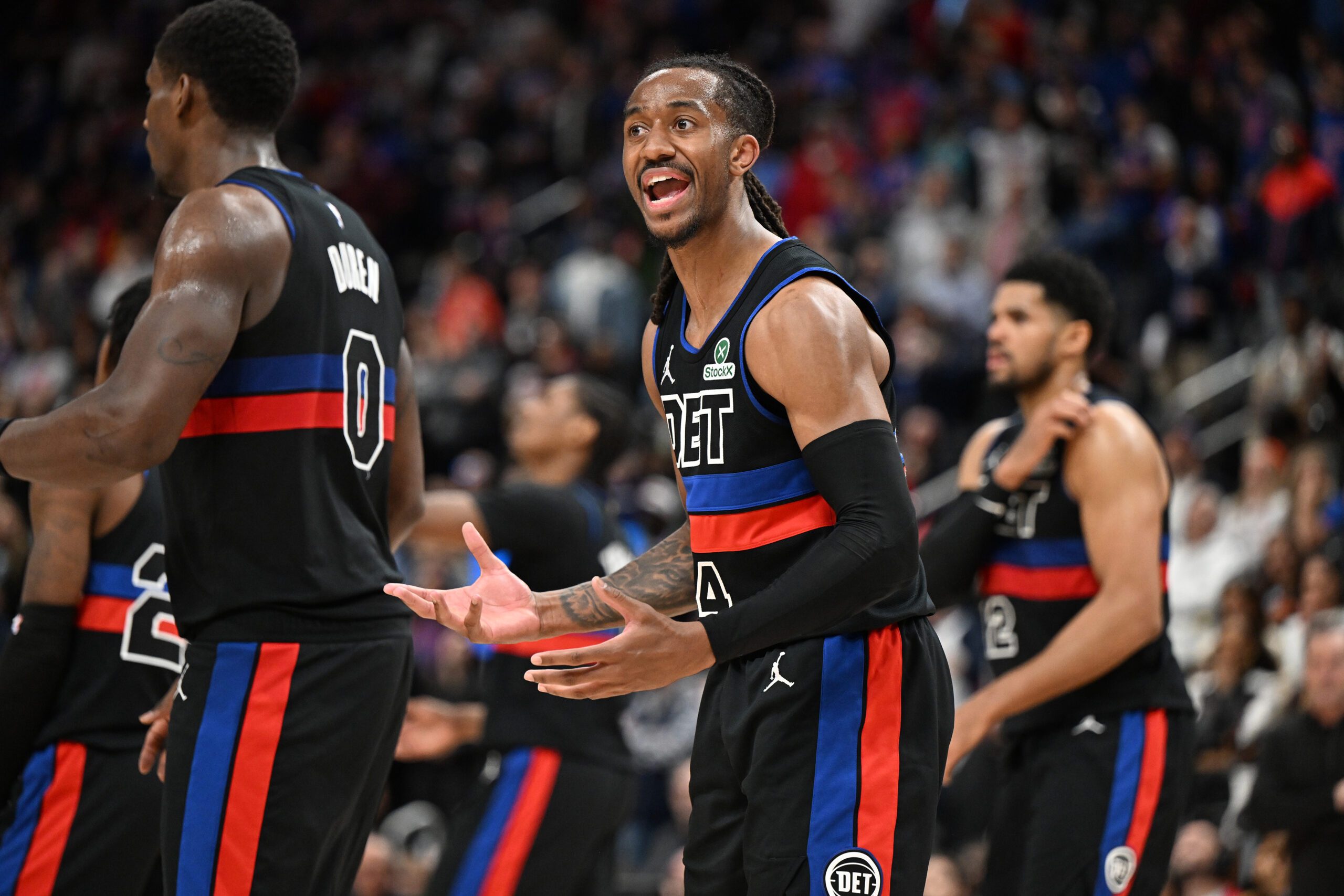 Feb 27, 2026; Detroit, Michigan, USA;  Detroit Pistons guard Daniss Jenkins (24) argues a foul call against the Cleveland Cavaliers with an official in overtime at Little Caesars Arena. Mandatory Credit: Lon Horwedel-Imagn Images