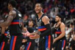 Feb 27, 2026; Detroit, Michigan, USA;  Detroit Pistons guard Daniss Jenkins (24) argues a foul call against the Cleveland Cavaliers with an official in overtime at Little Caesars Arena. Mandatory Credit: Lon Horwedel-Imagn Images