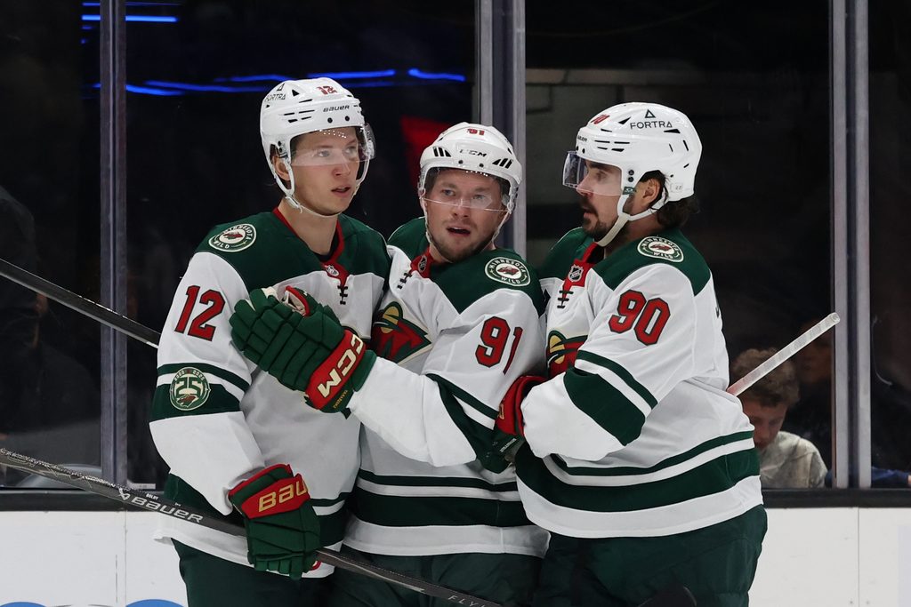 Feb 27, 2026; Salt Lake City, Utah, USA; Minnesota Wild left wing Matt Boldy (12) celebrates scoring a goal with right wing Vladimir Tarasenko (91) and left wing Marcus Johansson (90) during the third period at Delta Center. Mandatory Credit: Rob Gray-Imagn Images