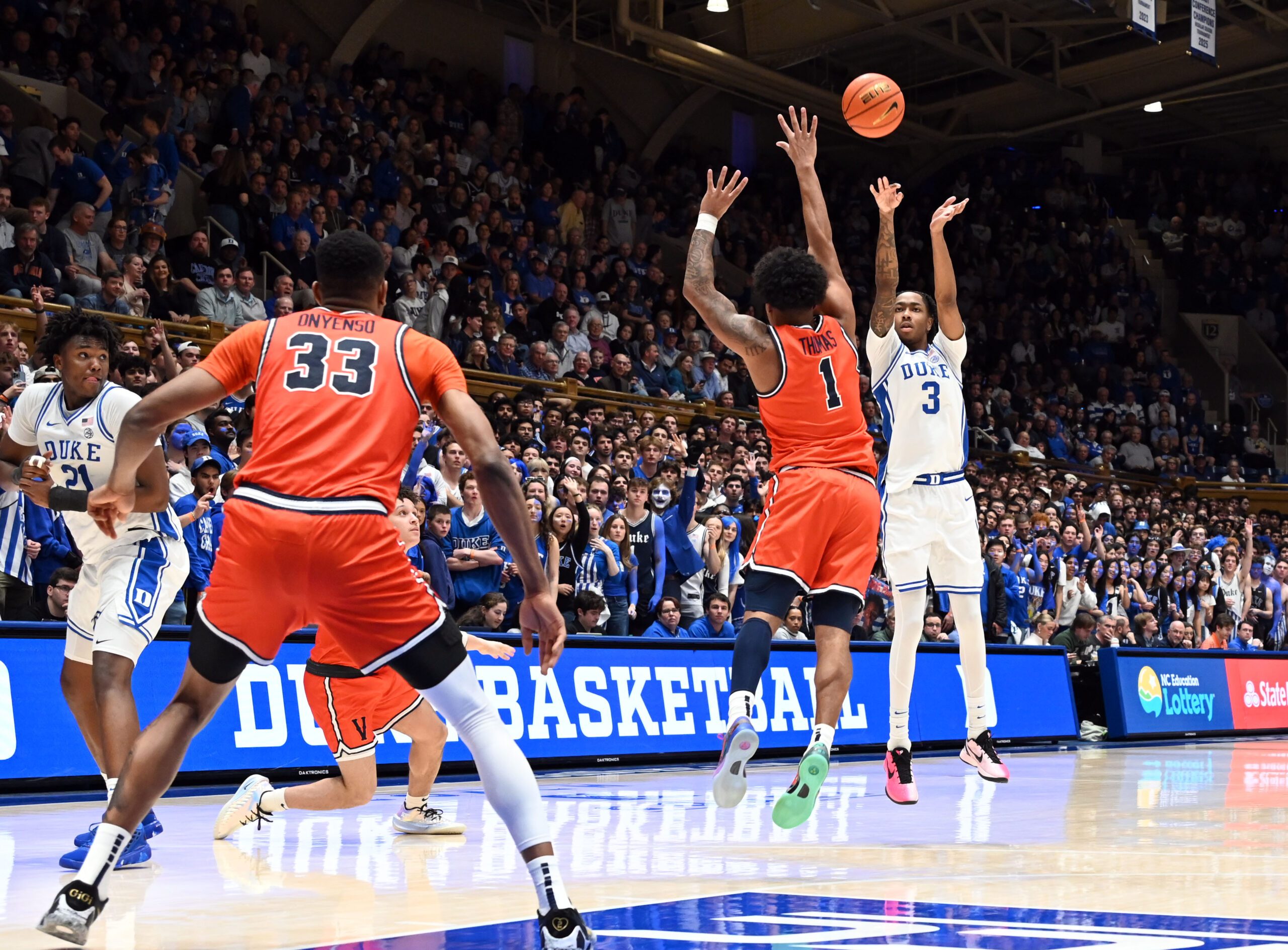 Feb 28, 2026; Durham, North Carolina, USA; Duke Blue Devils forward Isaiah Evans (3) shoots over Virginia Cavaliers guard Malik Thomas (1) during the second half at Cameron Indoor Stadium.   Duke won 77-51.  Mandatory Credit: Rob Kinnan-Imagn Images