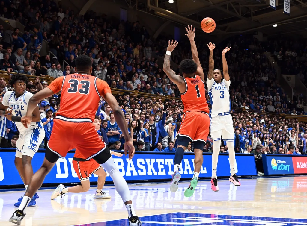Feb 28, 2026; Durham, North Carolina, USA; Duke Blue Devils forward Isaiah Evans (3) shoots over Virginia Cavaliers guard Malik Thomas (1) during the second half at Cameron Indoor Stadium. Duke won 77-51. Mandatory Credit: Rob Kinnan-Imagn Images