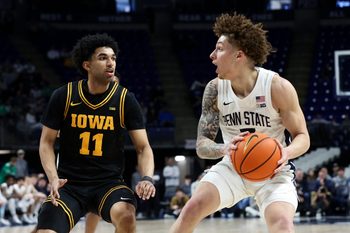 Feb 28, 2026; University Park, Pennsylvania, USA; Penn State Nittany Lions guard Dominick Stewart (7) looks to pass the ball as Iowa Hawkeyes guard Kael Combs (11) defends during the first half at Bryce Jordan Center. Mandatory Credit: Matthew O'Haren-Imagn Images