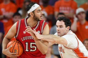 Louisville Cardinals center Aly Khalifa (15) is defended by Clemson Tigers forward Nick Davidson (11) Saturday, Feb. 28, 2026, during the NCAA men’s basketball game at Littlejohn Coliseum in Clemson, South Carolina. Clemson Tigers won 80-75.